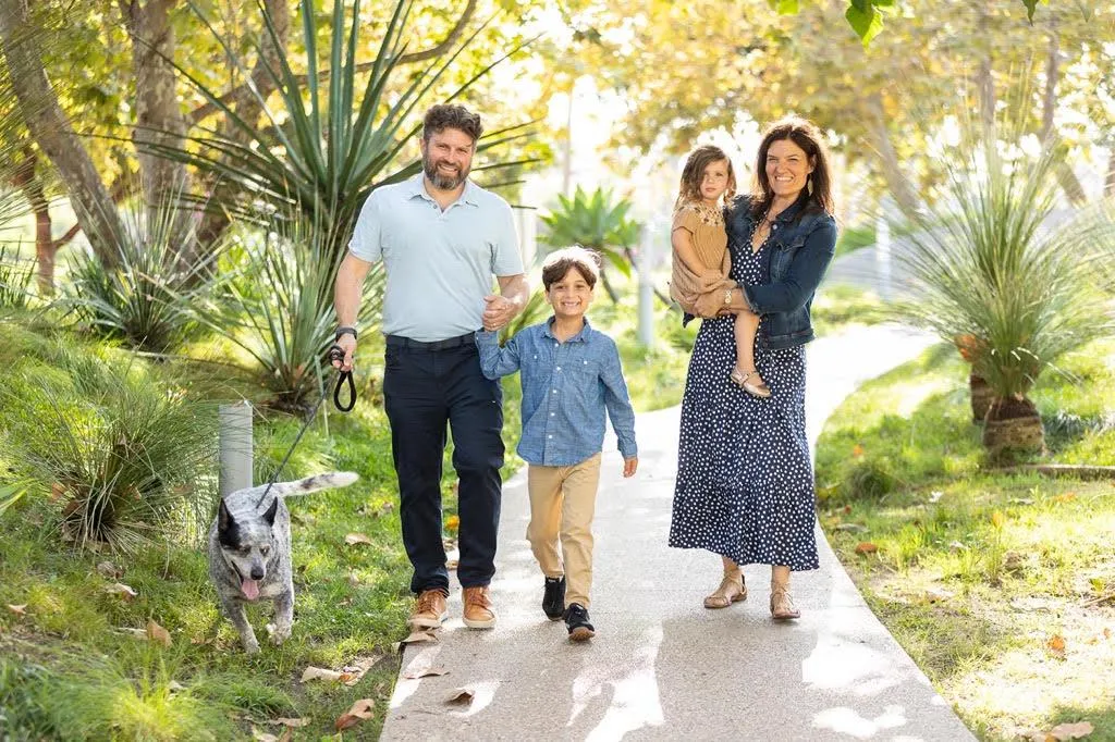 Heather Thomason walking with her family and their dog